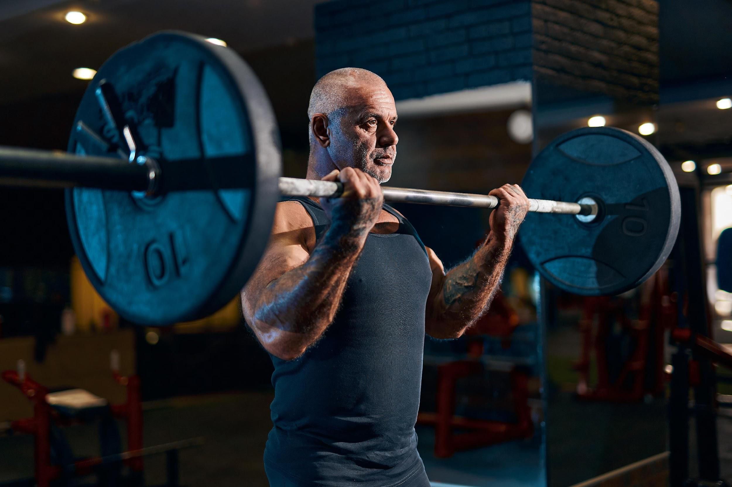 old man lifting weights