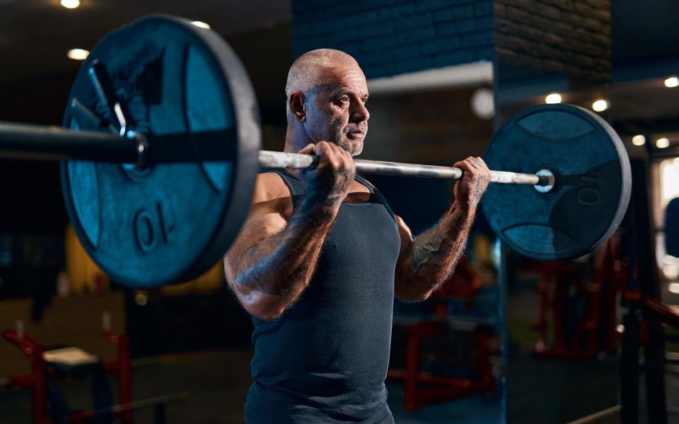 old man lifting weights